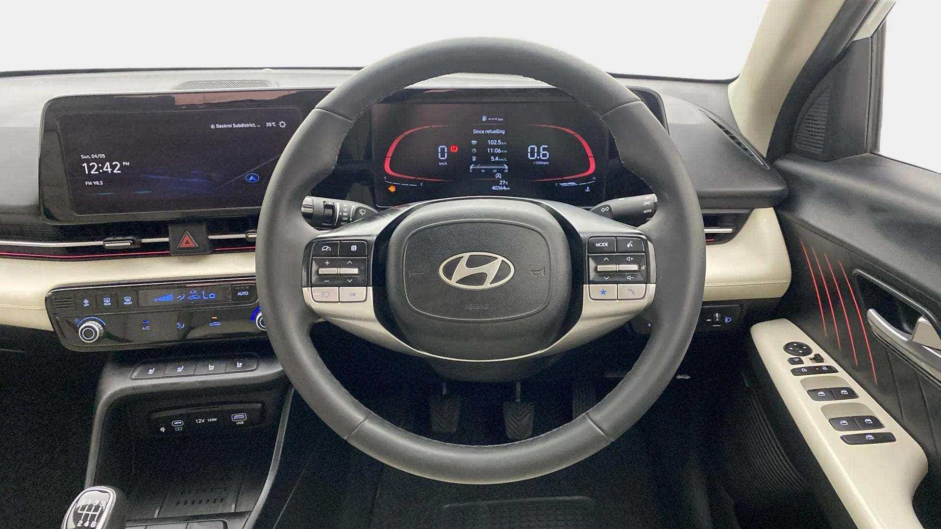 Interior dashboard and steering wheel of a Hyundai Verna