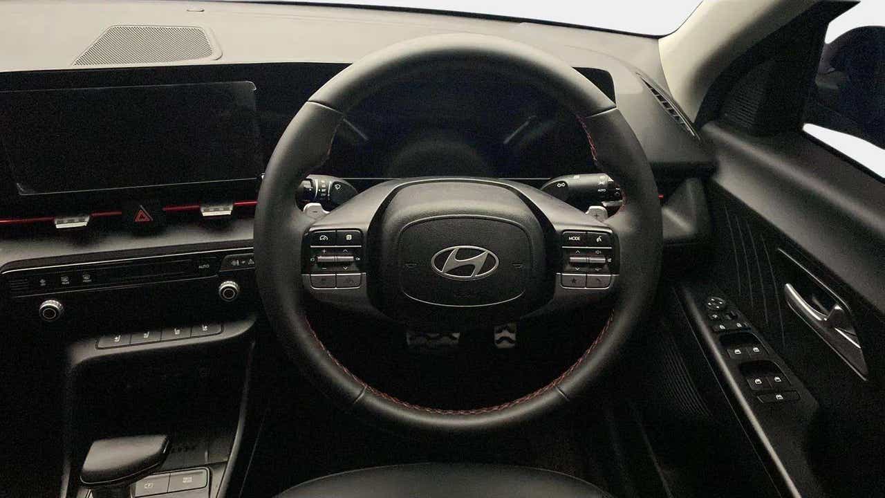Interior dashboard and steering wheel of a Hyundai Verna