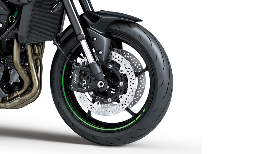 Front wheel and brake close-up of a CANDY LIME GREEN Kawasaki Z900 2026