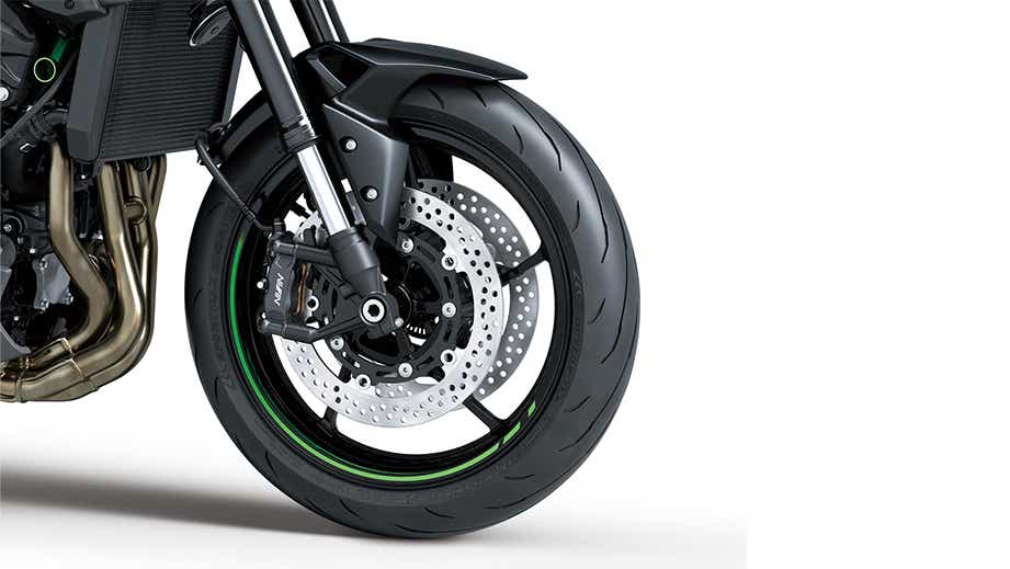 Front wheel and brake close-up of a CANDY LIME GREEN Kawasaki Z900 2026