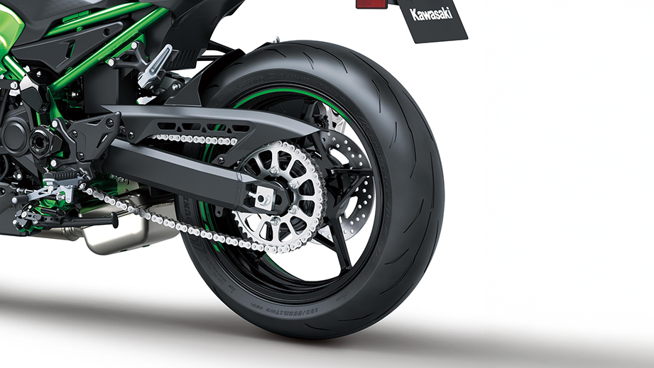 Rear wheel view of a candy lime green Kawasaki Z900 2026