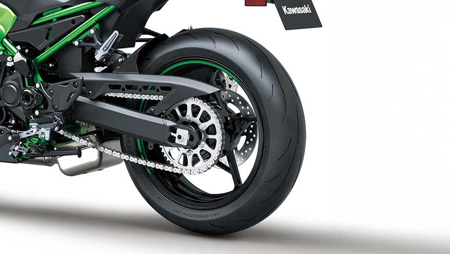 Rear wheel view of a candy lime green Kawasaki Z900 2026
