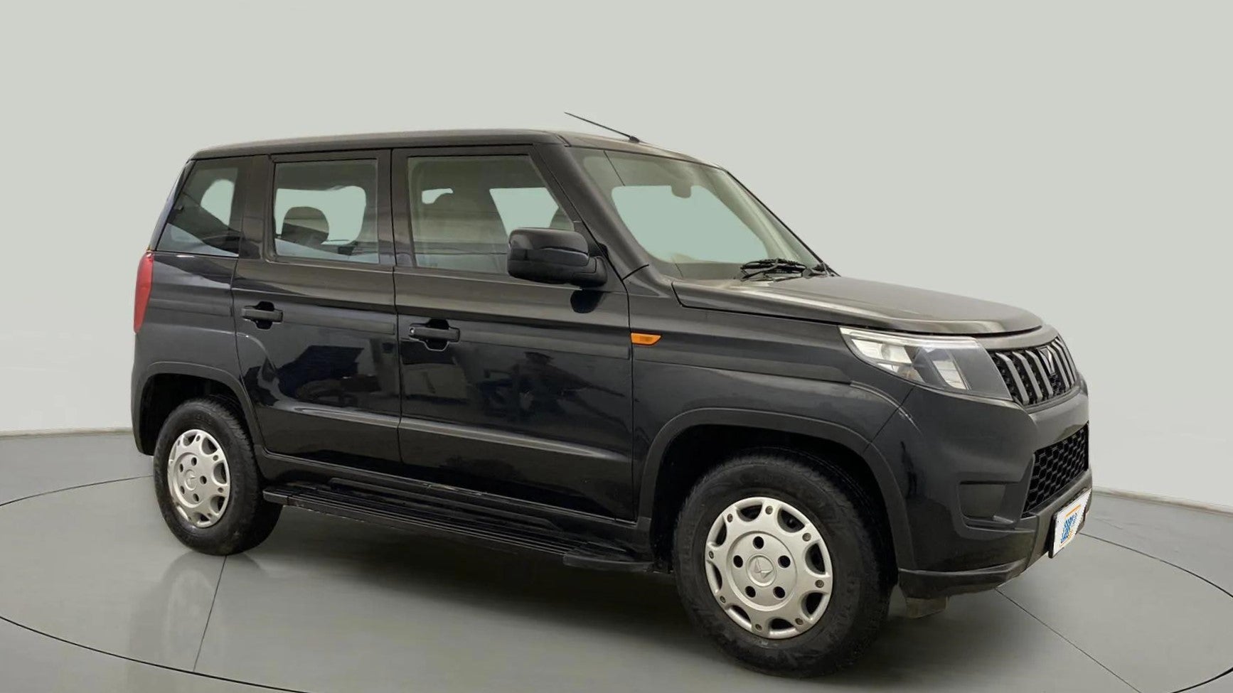 Side view of a Mahindra Bolero Neo