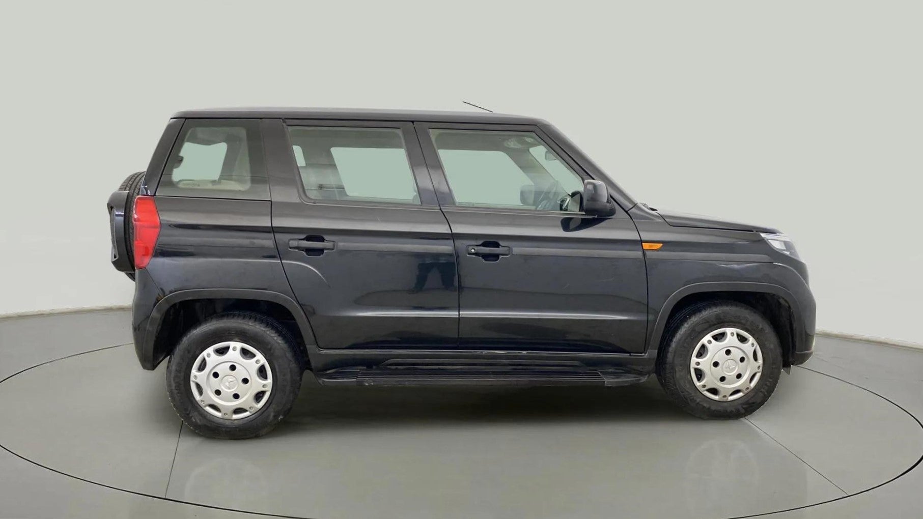 Side view of a Mahindra Bolero Neo