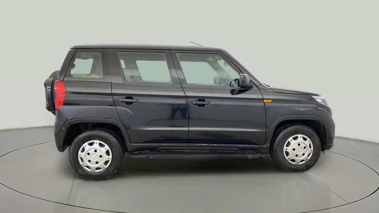 Side view of a Mahindra Bolero Neo