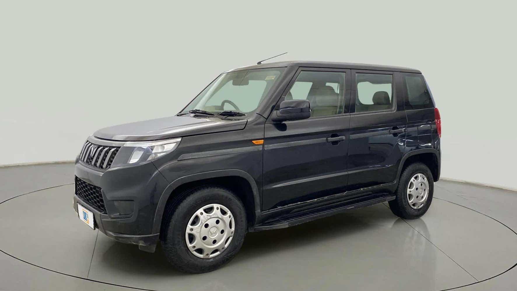 Front and side view of a Mahindra Bolero Neo