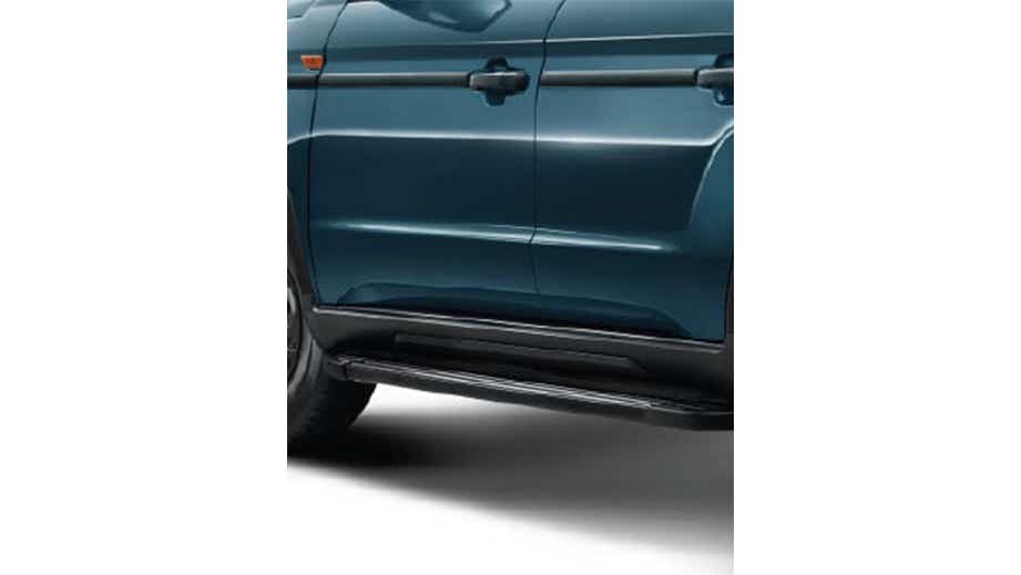 Side profile close-up of a jeans blue Mahindra Bolero Neo