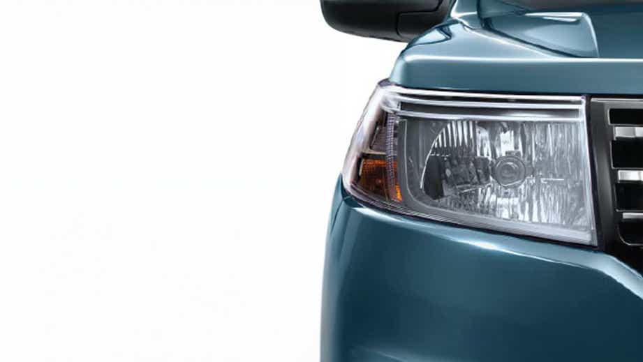 Headlight close-up of a Mahindra Bolero Neo