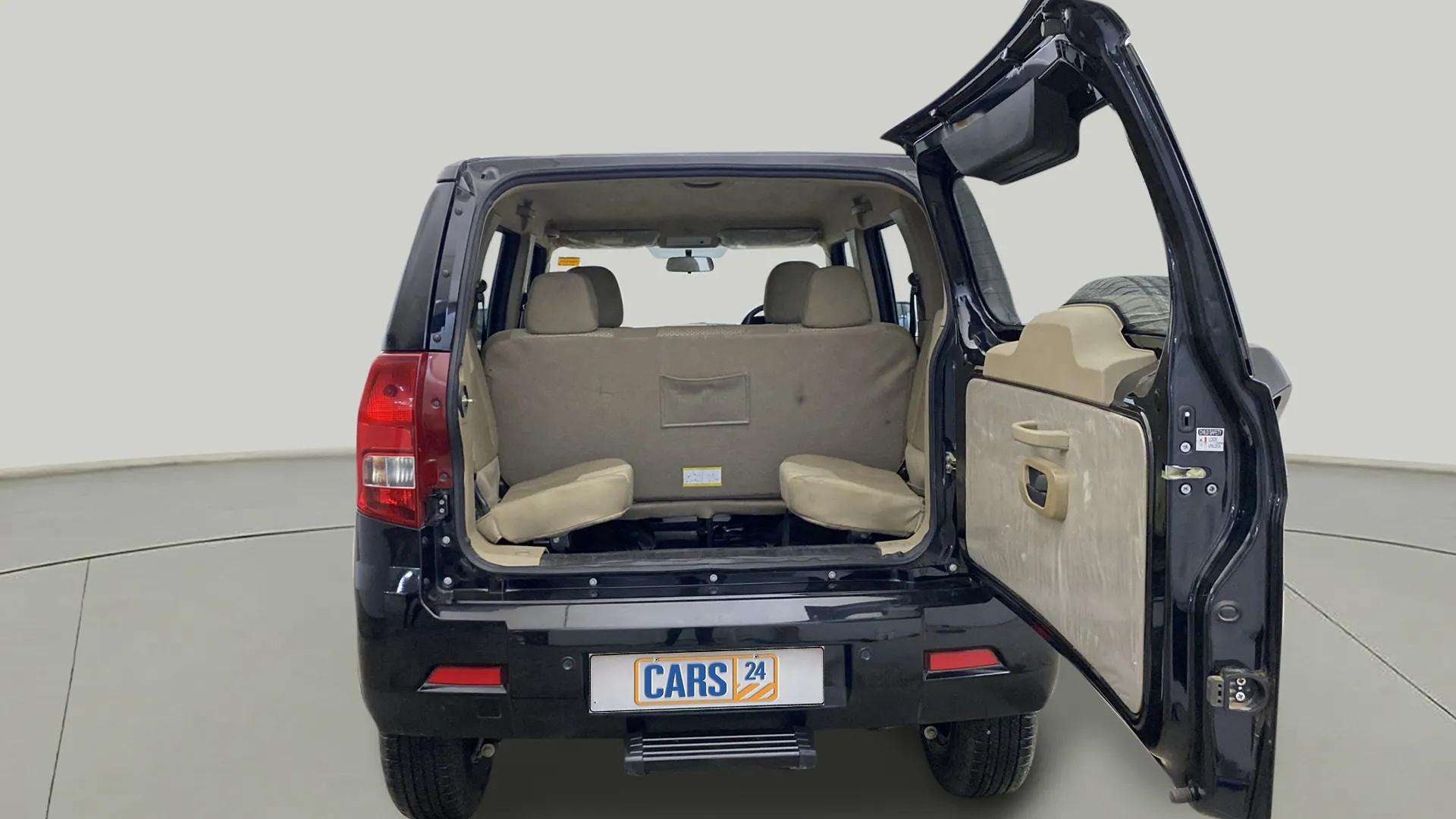 Rear view of a Mahindra Bolero Neo with open boot