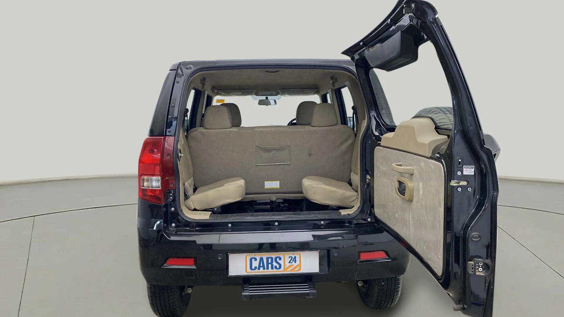 Rear view of a Mahindra Bolero Neo with open boot