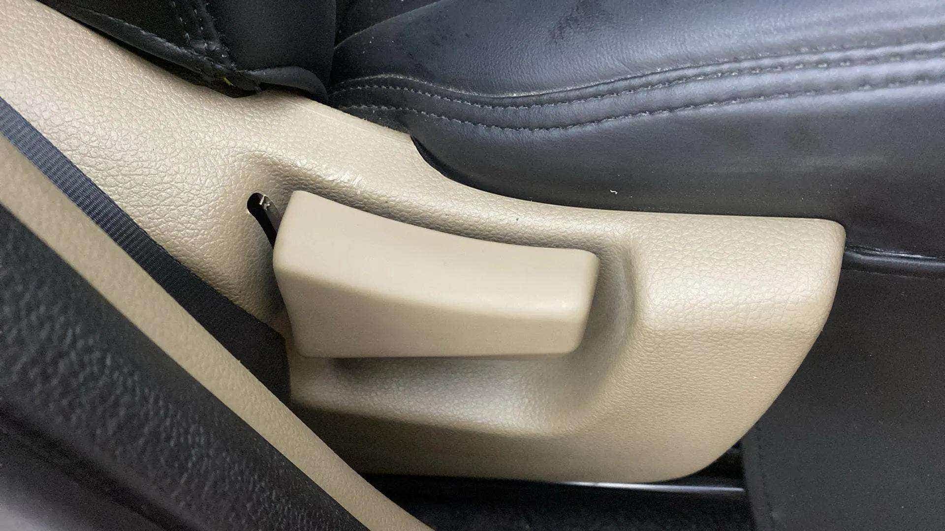 Seat height adjustment lever of a Mahindra Bolero Neo