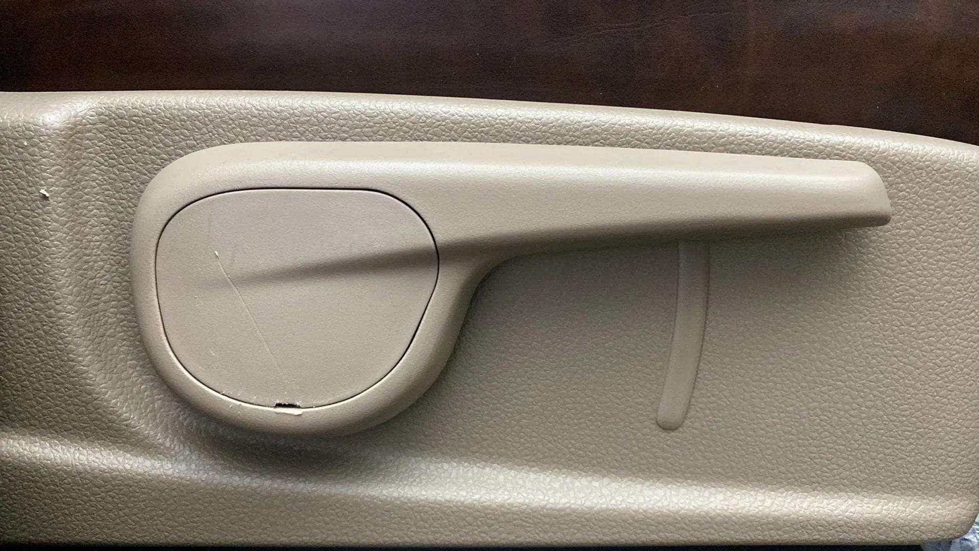 Close-up of an interior door handle of a Mahindra Bolero Neo