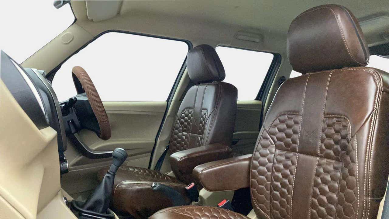 Interior front seats and dashboard of a Mahindra Bolero Neo