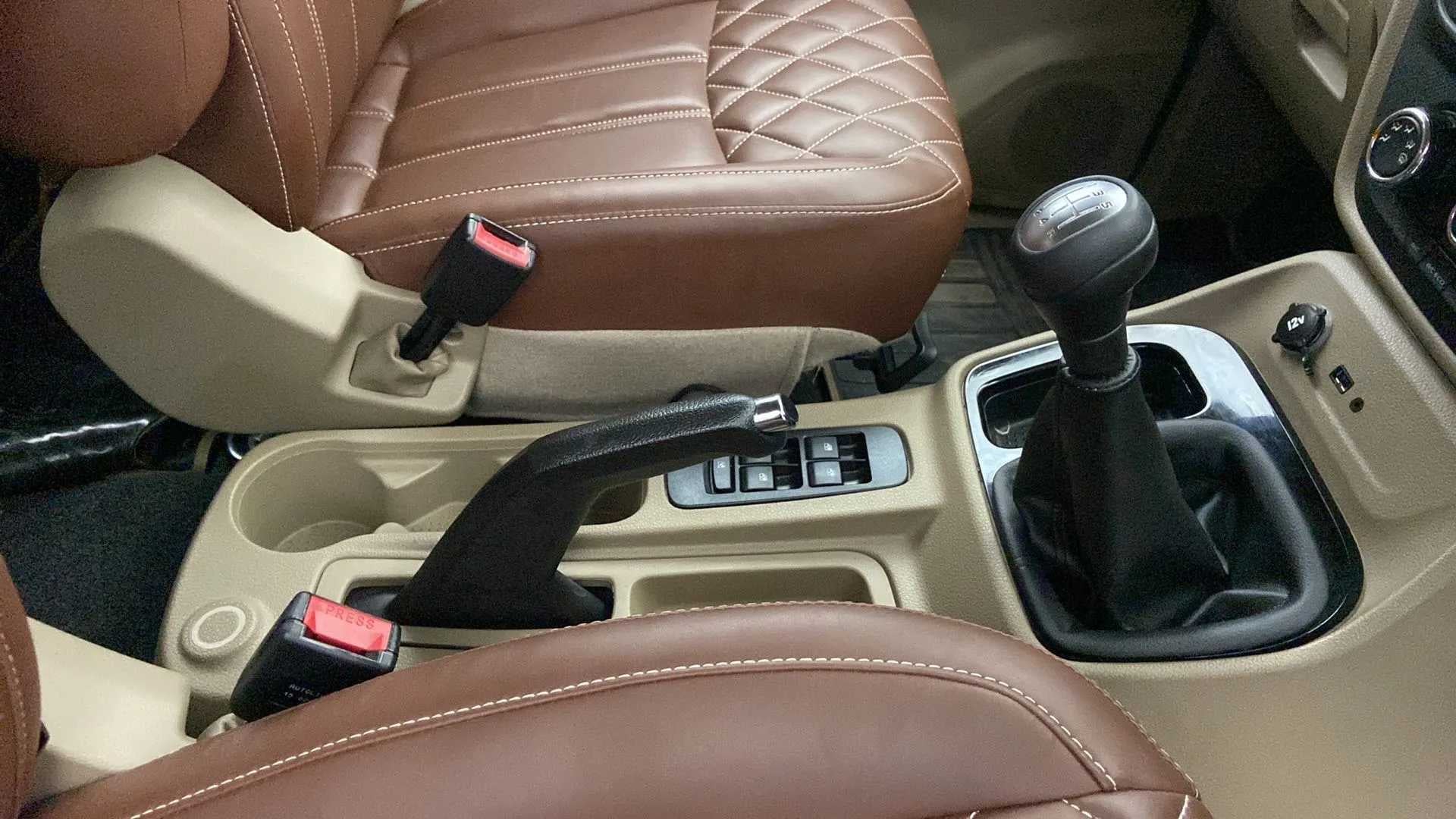 Interior gear shifter and seats of a Mahindra Bolero Neo