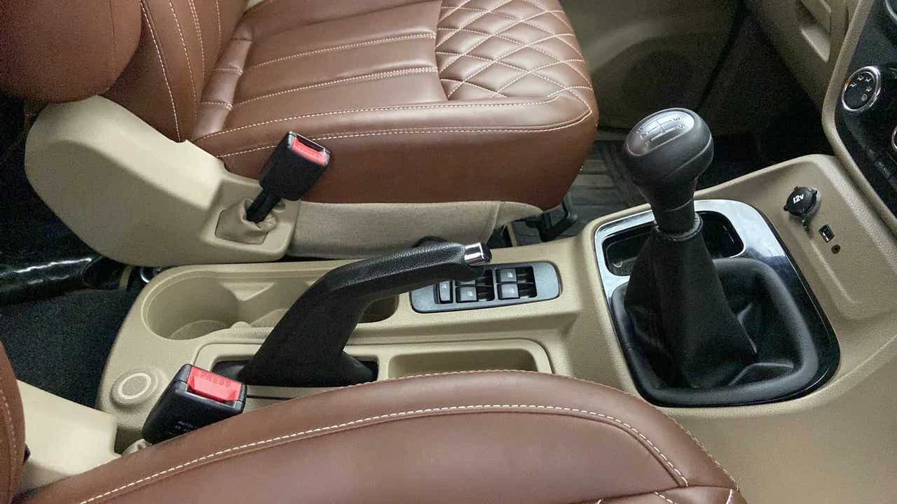 Interior gear shifter and seats of a Mahindra Bolero Neo