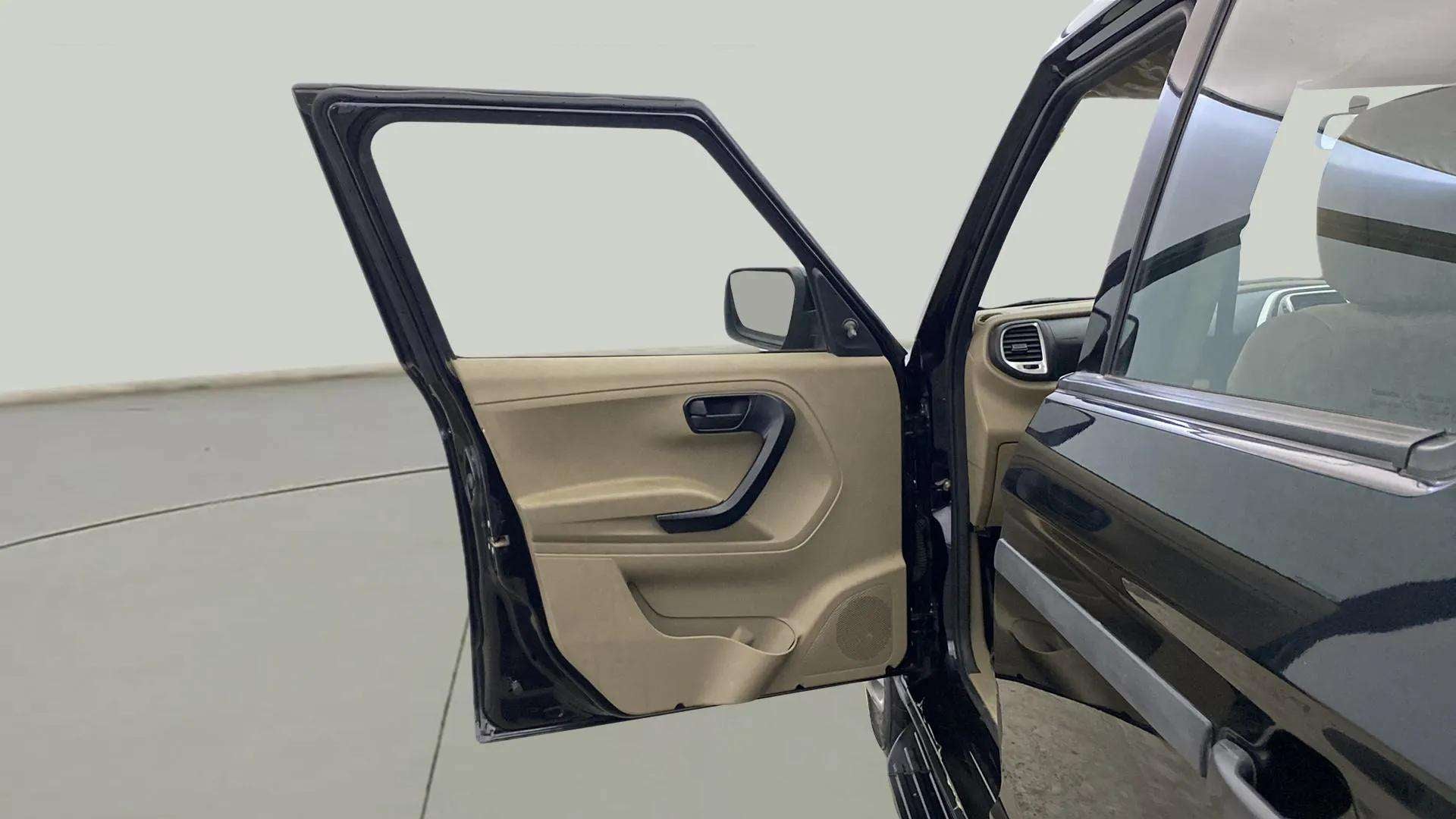 Front driver-side door open view of a Mahindra Bolero Neo