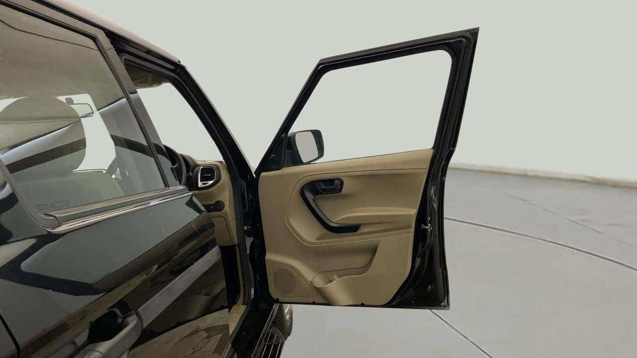Front left door open view of a Mahindra Bolero Neo