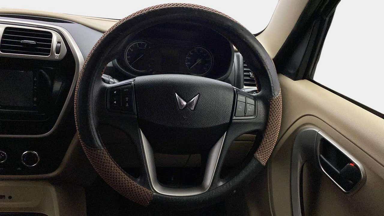 Interior dashboard and steering wheel of a Mahindra Bolero Neo