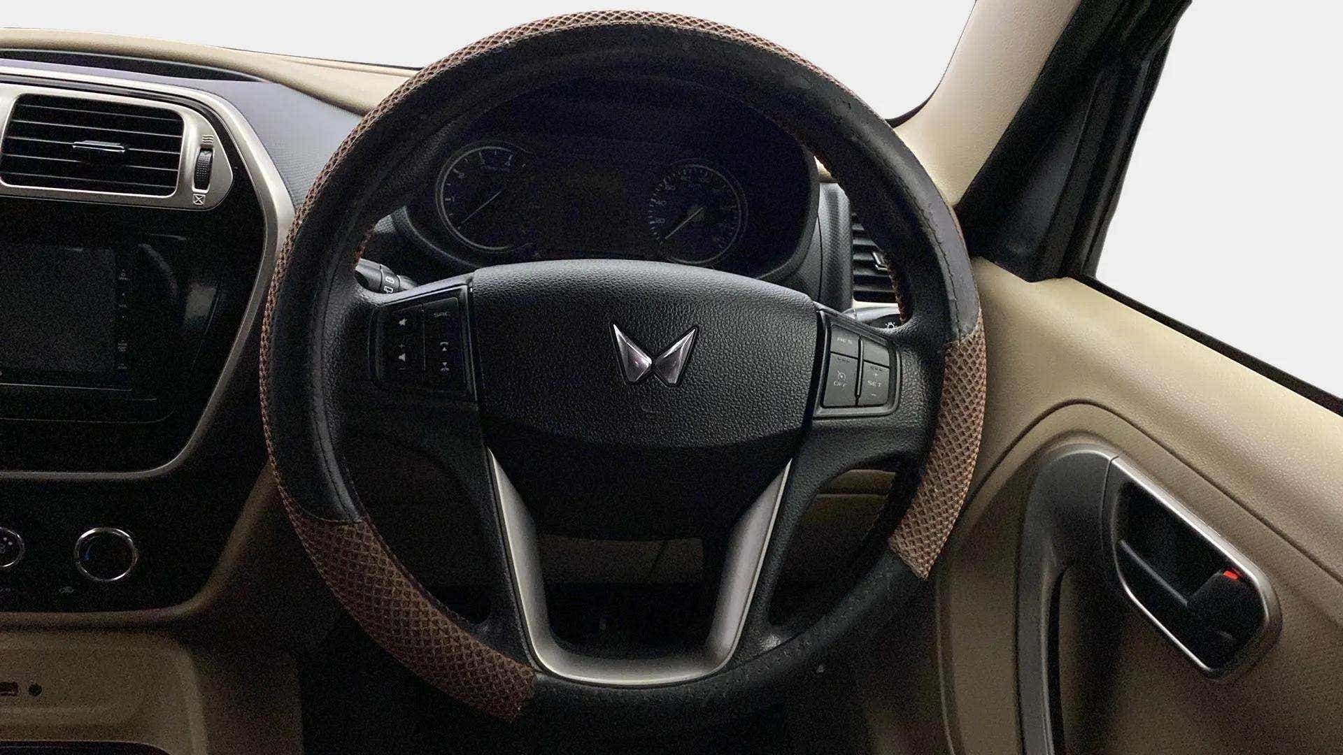 Interior dashboard and steering wheel of a Mahindra Bolero Neo