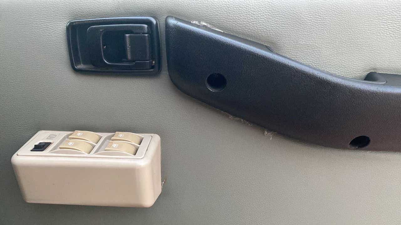 Door armrest and power window control panel of a Mahindra Bolero