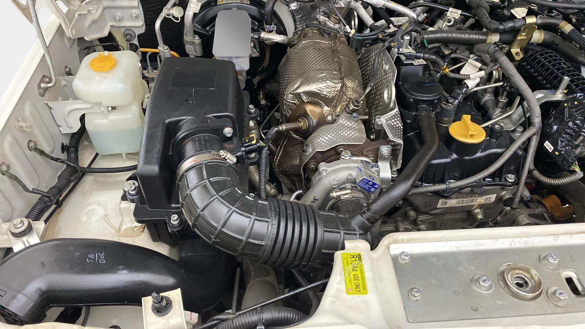Engine bay view of a Mahindra Bolero