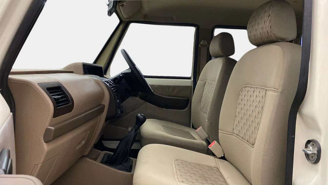 Interior front seats and dashboard of a Mahindra Bolero