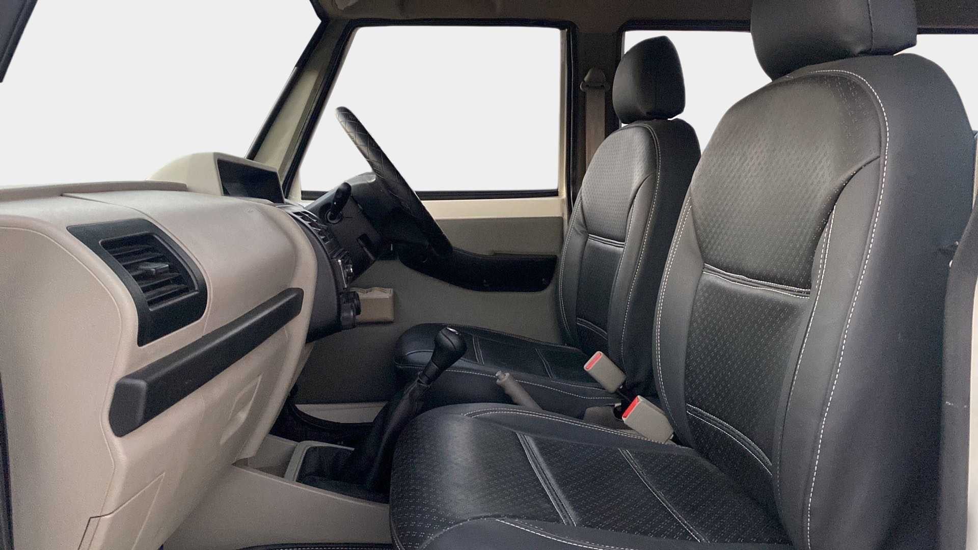 Interior dashboard and front seats of a Mahindra Bolero