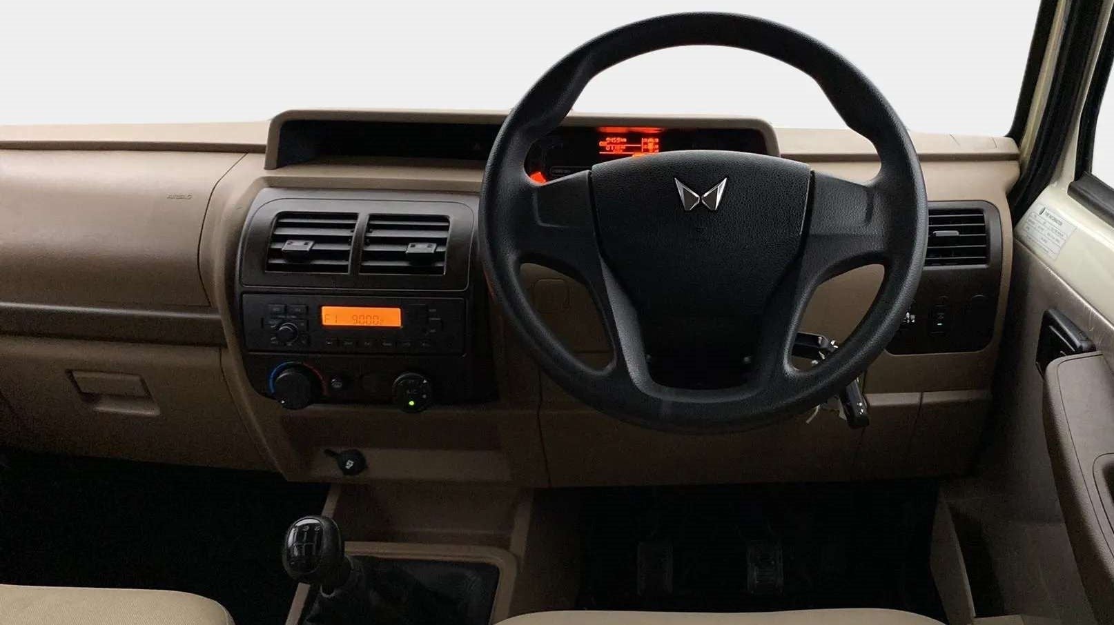 Dashboard and steering wheel view of a Mahindra Bolero