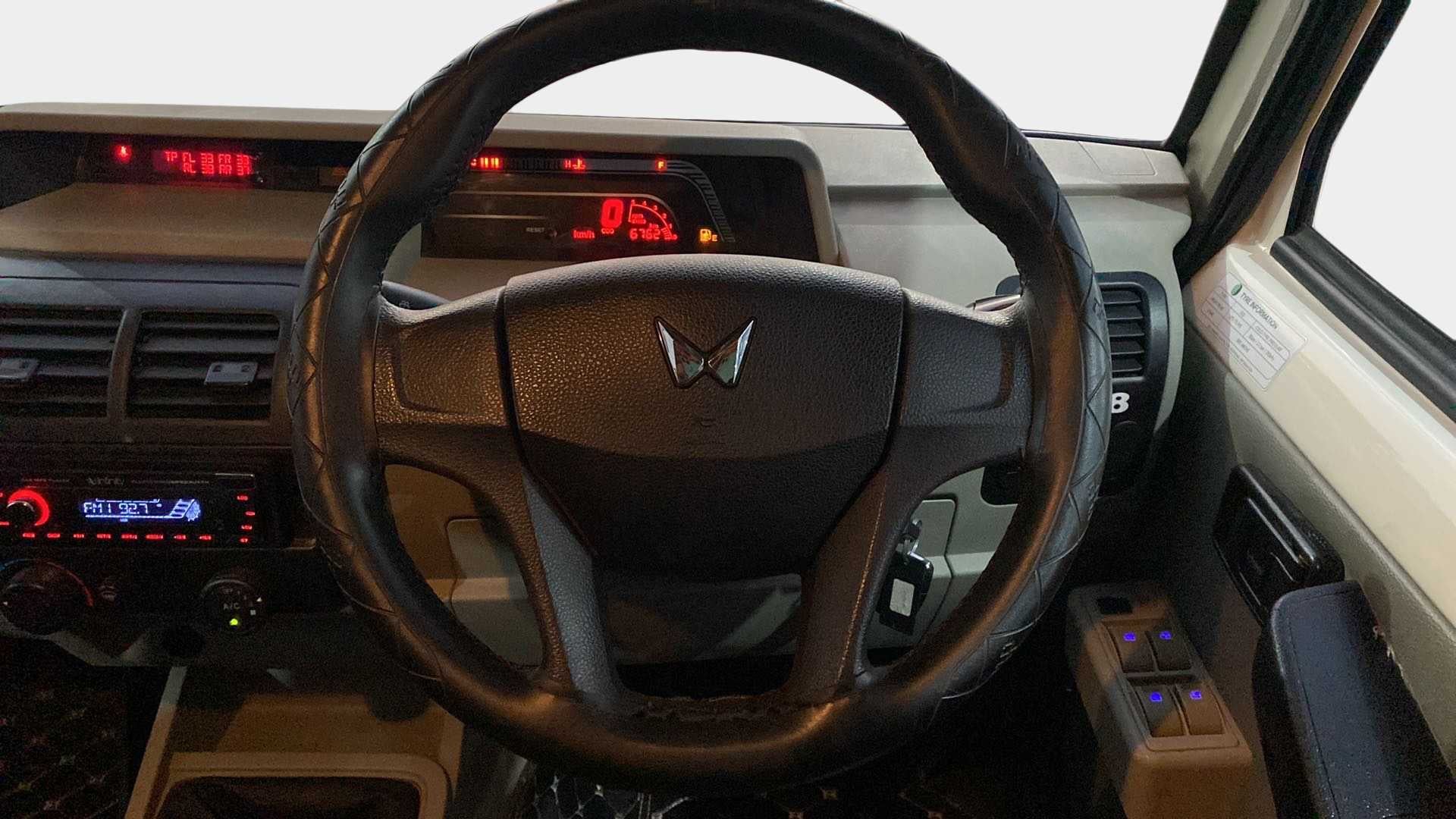 Dashboard and steering wheel view of a Mahindra Bolero
