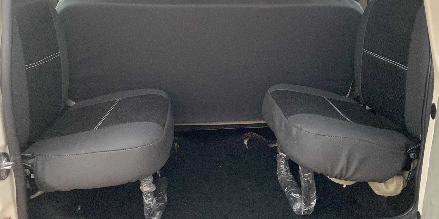 Rear interior seat view of a Mahindra Bolero