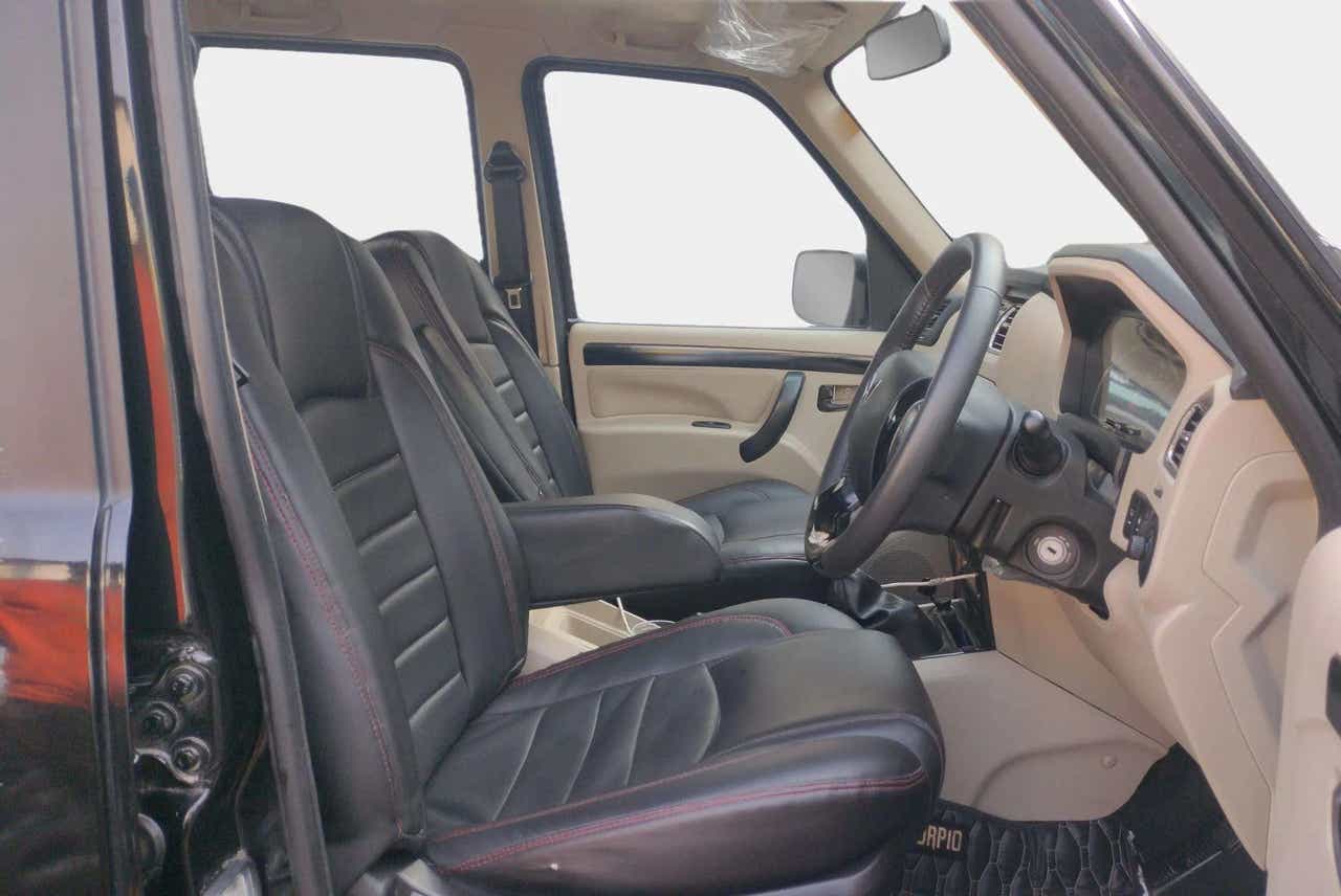 Interior front seats and dashboard of a Mahindra Scorpio Classic