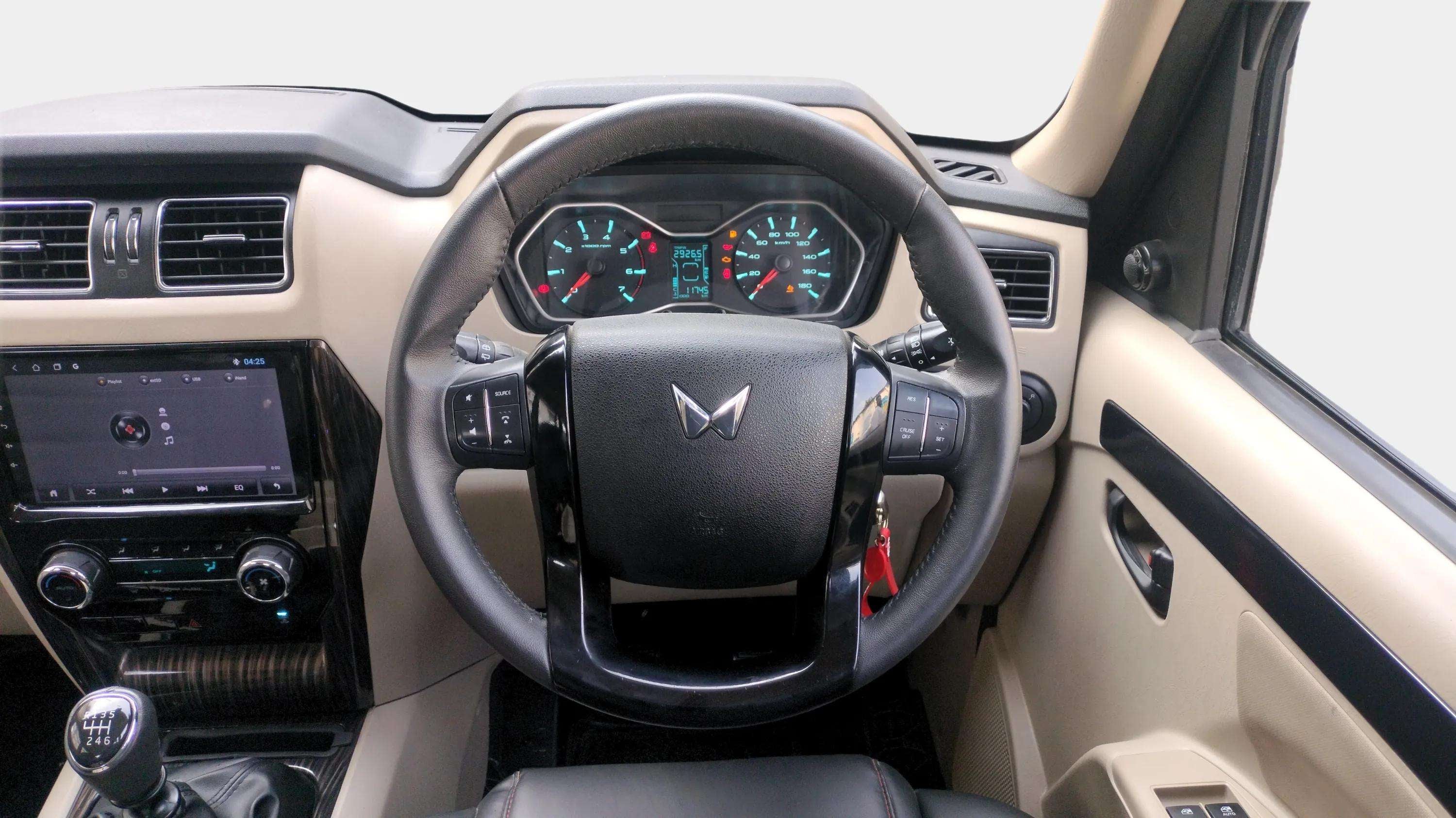 Interior dashboard and steering wheel of a Mahindra Scorpio Classic
