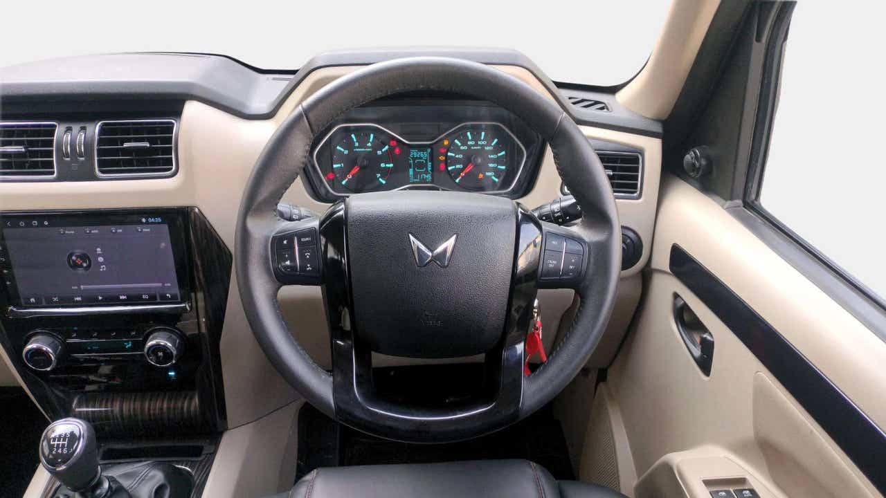 Interior dashboard and steering wheel of a Mahindra Scorpio Classic