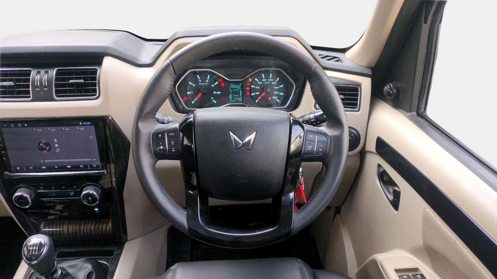 Interior dashboard and steering wheel of a Mahindra Scorpio Classic