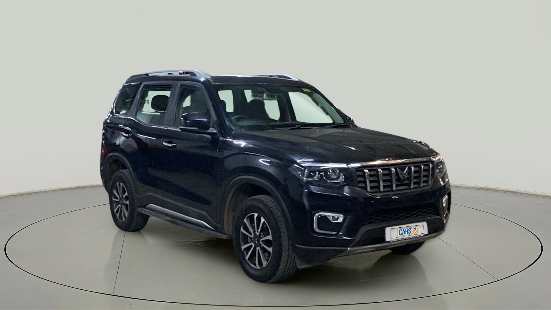 Front three-quarter view of a deep forest Mahindra Scorpio-N