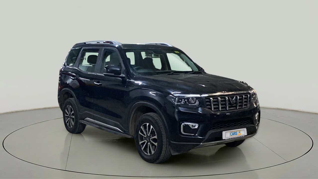 Front three-quarter view of a deep forest Mahindra Scorpio-N