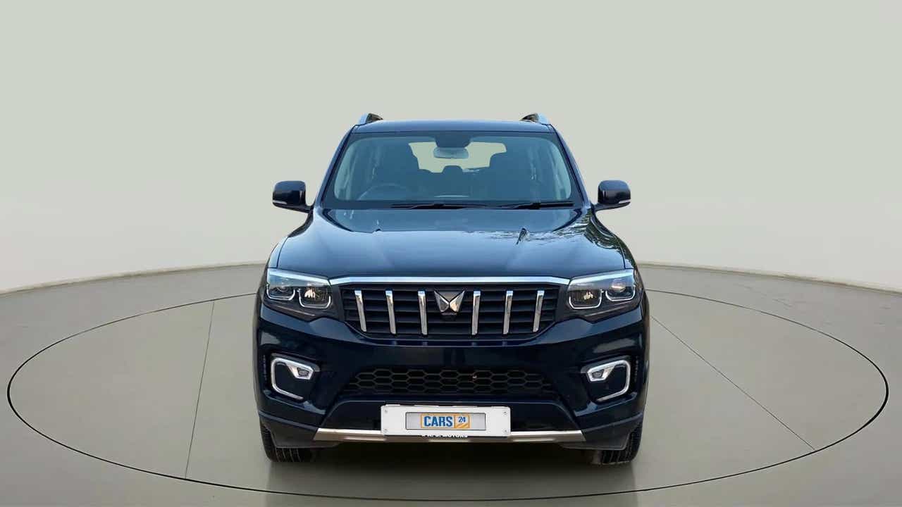 Front view of a deep forest Mahindra Scorpio-N