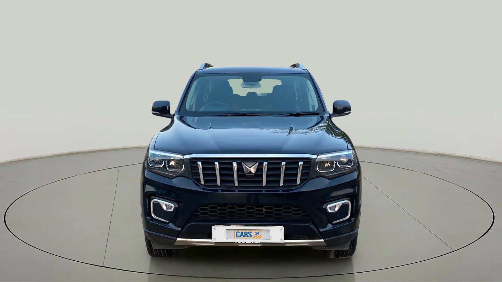 Front view of a deep forest Mahindra Scorpio-N