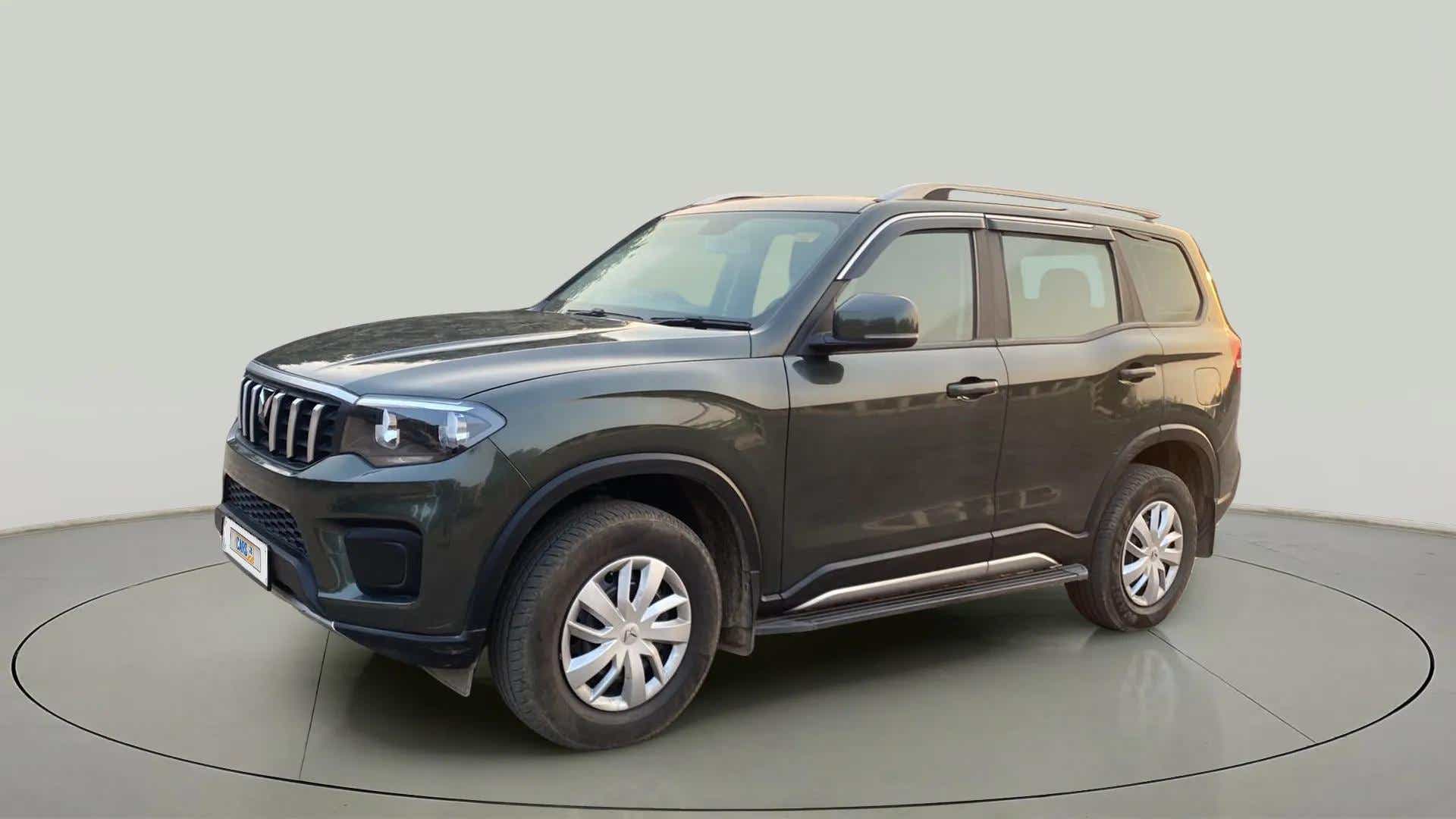Front three-quarter of a deep forest Mahindra Scorpio-N
