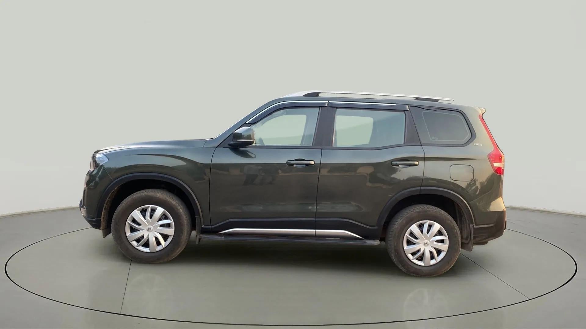 Side view of a Deep Forest Mahindra Scorpio-N