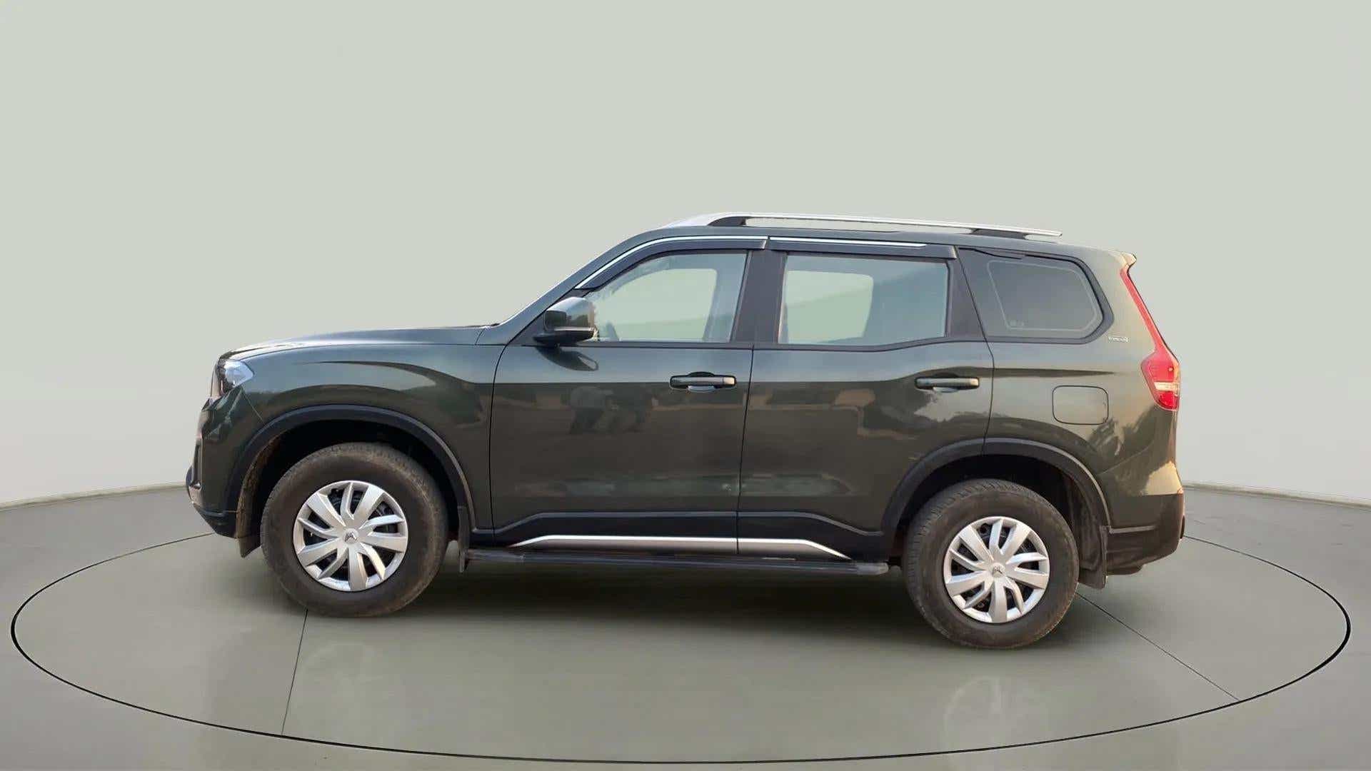 Side view of a Deep Forest Mahindra Scorpio-N