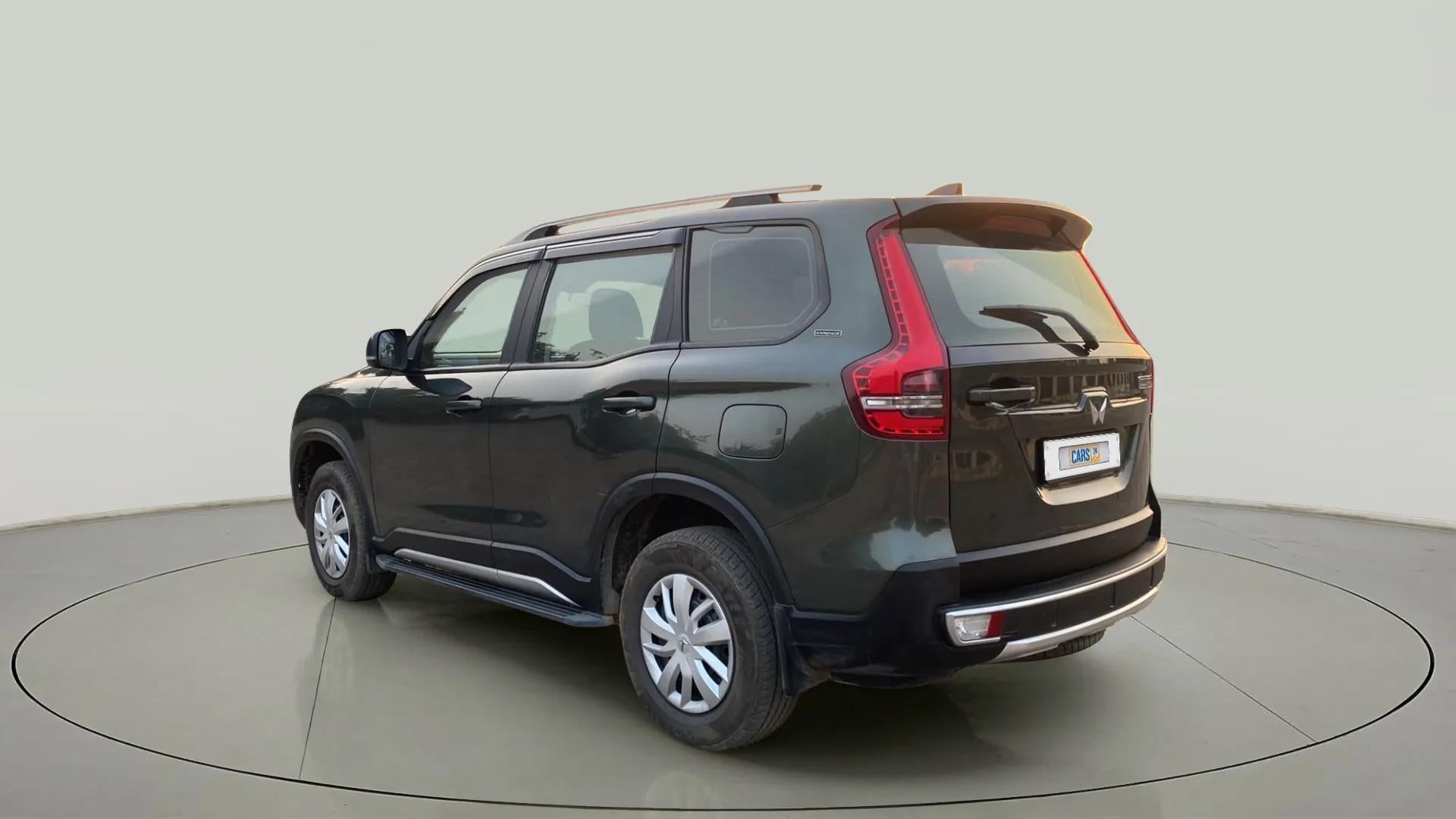 Rear three-quarter view of a deep forest Mahindra Scorpio-N