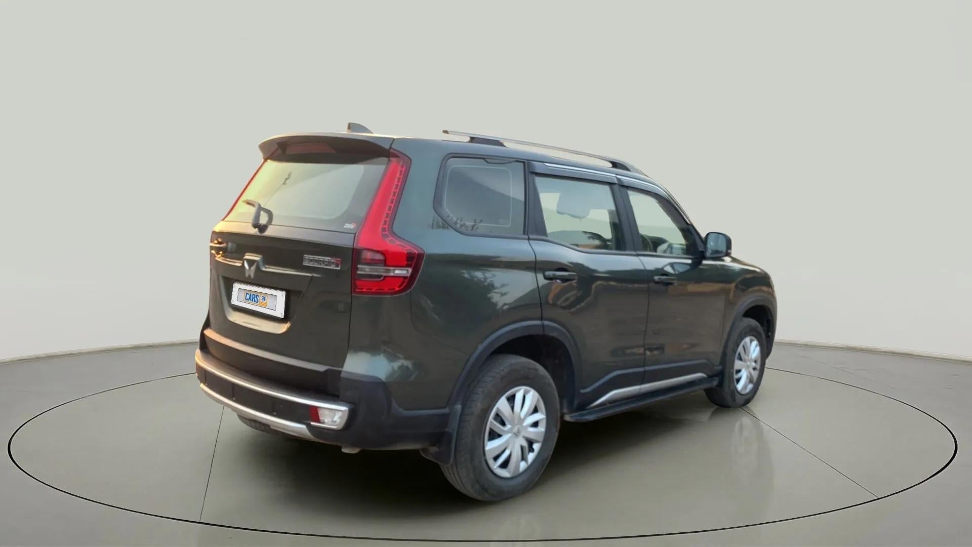 Rear three-quarter view of a deep forest Mahindra Scorpio-N