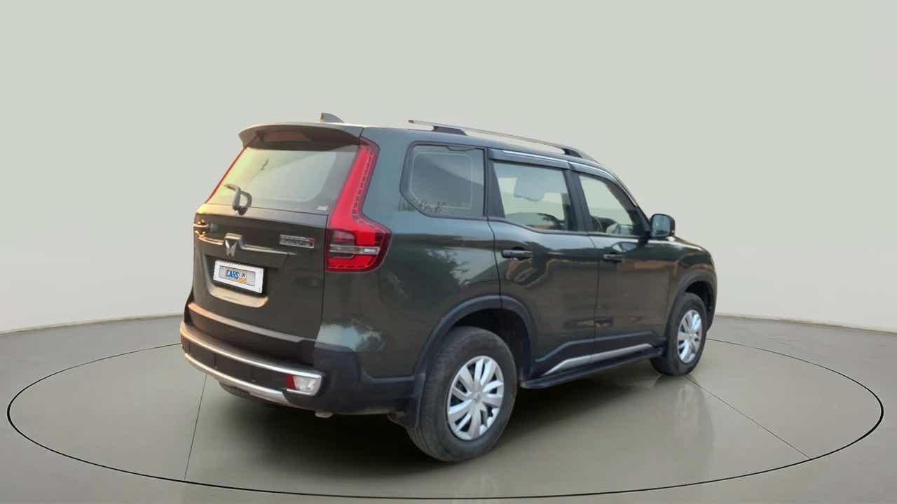 Rear three-quarter view of a deep forest Mahindra Scorpio-N