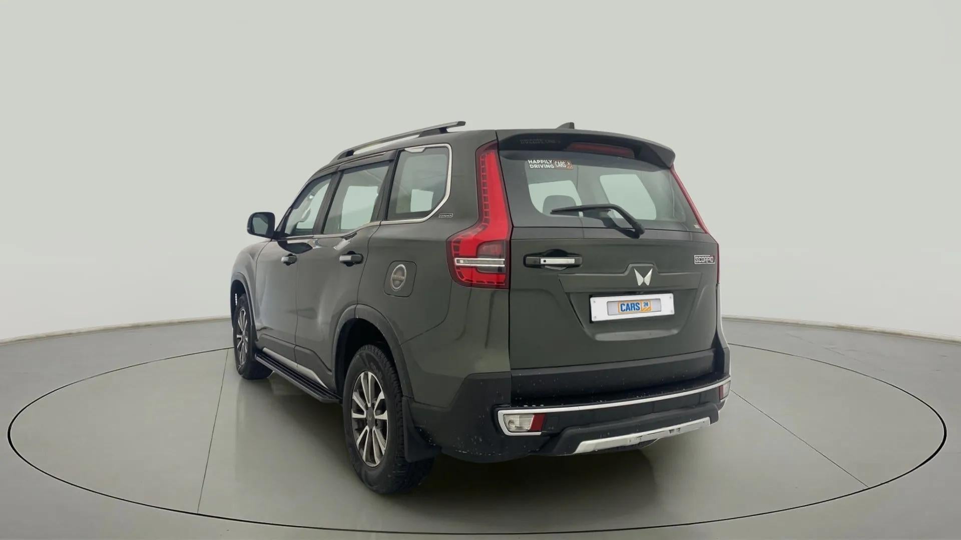 Rear three-quarter of a deep forest Mahindra Scorpio-N