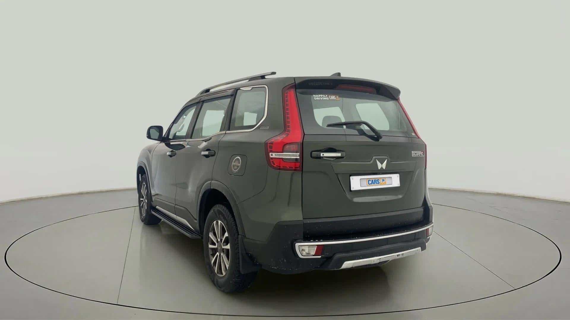Rear three-quarter of a deep forest Mahindra Scorpio-N