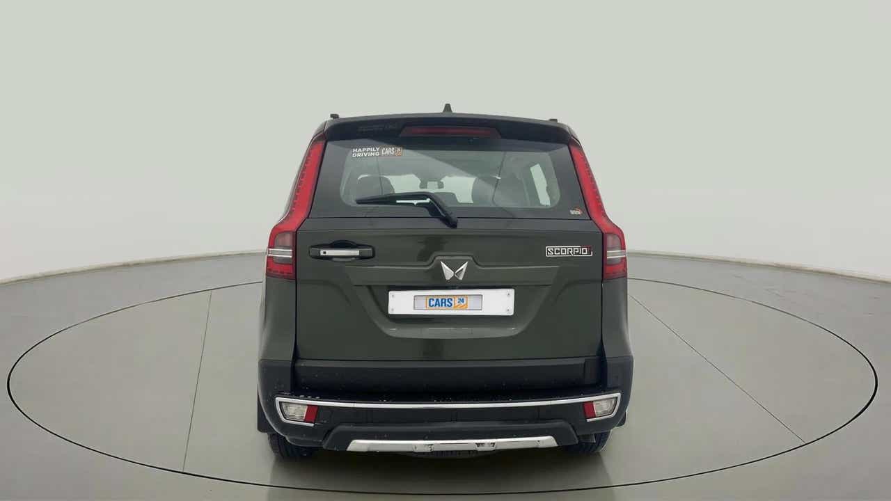 Rear view of a deep forest Mahindra Scorpio-N