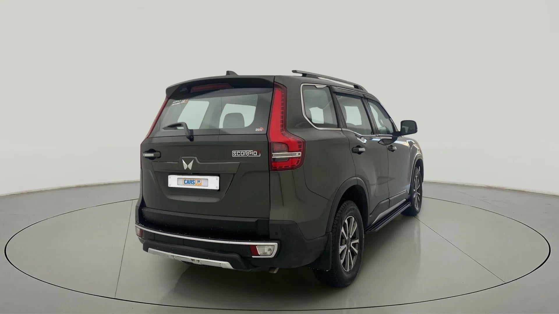 Rear three-quarter view of a deep forest Mahindra Scorpio-N