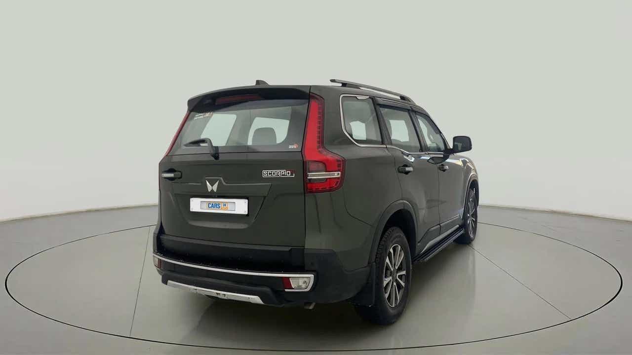 Rear three-quarter view of a deep forest Mahindra Scorpio-N