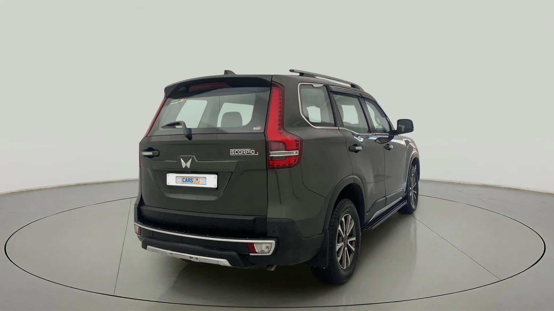 Rear three-quarter view of a deep forest Mahindra Scorpio-N